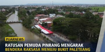 Ratusan Pemuda Pinrang Mengarak Bendera Raksasa Menuju Bukit Paleteang