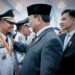 Presiden RI, Prabowo Subianto didampingi Wakil Presiden, Gibran Rakabuming Raka memberi ucapan selama kepada Gubernur Sulsel terpilih, Andi Sudirman Sulaiman usai pelantikan kepala daerah se-Indonesia di Istana Merdeka, Jakarta, Kamis (20/2/2025)